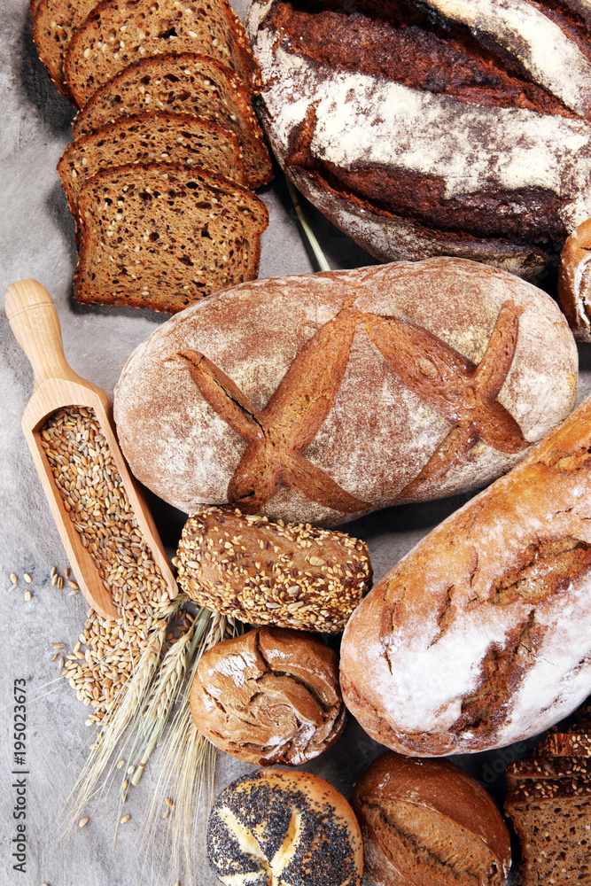 Wall mural different kinds of bread and bread rolls. kitchen or bakery poster