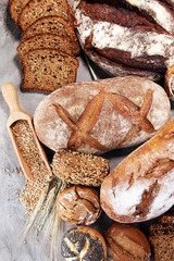 Different kinds of bread and bread rolls. Kitchen or bakery poster