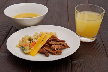 Seitan on the onion and couscous with corn