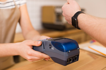 Close up of a credit card terminal being in use