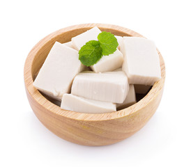 Tofu in wooden bowl isolated on white background