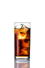 dark drink with ice in a glass on a white background