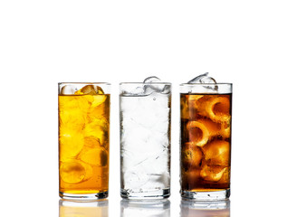 three drinks with ice in a range on a white background