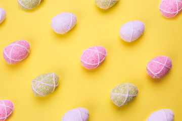 Colorful Easter egg on yellow paper background