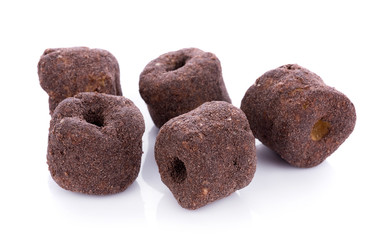 Crunchy corn chocolate snacks on a white background