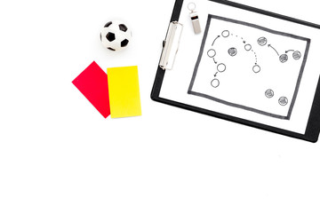 Sport judging concept. Soccer referee. Tactic plan for game, football ball, red and yellow cards, whistle on white background top view copy space