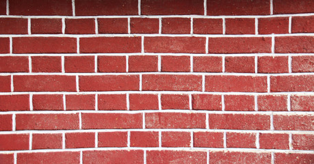 A Picture of a Red brick wall nicely decorated and patterned