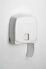 Dispenser for toilet paper isolated on white background