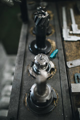 Metallurgy heavy industry. Details from factory for production industrial machines. Low light close up shot.