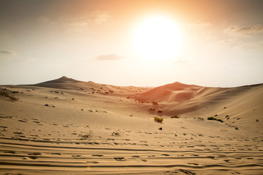 Beautiful sunset in the Sahara desert. Sand dunes at sunset.