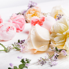 Festive flower composition on the white wooden background. Overhead view