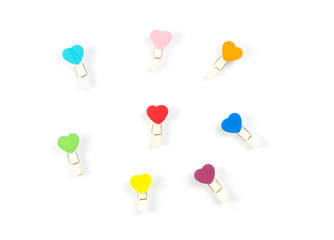 Top view Wooden colorful Paper Clip Heart set isolate on white background. Concept in love in office, copy paste