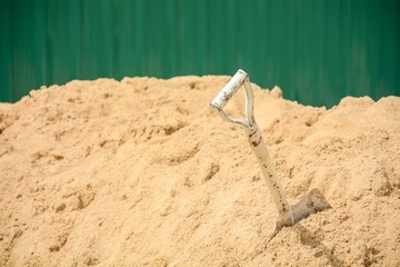 steel shovel at the sand pile