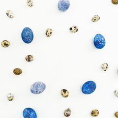 Round frame with quail and blue Easter eggs isolated on white background. Flat lay, Top view. Easter concept.