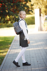 pretty girl in the park on her way to school