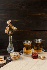 Turkish tea ceremony. Eastern authentic tea time. Breakfast for two people. Cookies, jam, tea, biscuits and rose flowers in a vase on a table cloth. Relaxation.All inclusive room service, Tasty meal