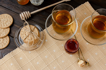 Turkish tea ceremony. Eastern authentic tea time. Breakfast for two people. Cookies, jam, tea, biscuits and rose flowers in a vase on a table cloth. Relaxation.All inclusive room service, Tasty meal