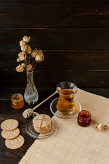 Turkish tea ceremony. Eastern authentic tea time. Breakfast for two people. Cookies, jam, tea, biscuits and rose flowers in a vase on a table cloth. Relaxation.All inclusive room service, Tasty meal