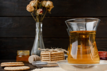 Turkish tea ceremony. Eastern authentic tea time. Breakfast for two people. Cookies, jam, tea, biscuits and rose flowers in a vase on a table cloth. Relaxation.All inclusive room service, Tasty meal