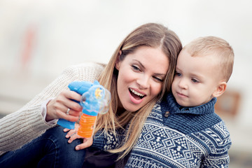 Mom and her son are havig fun in the city