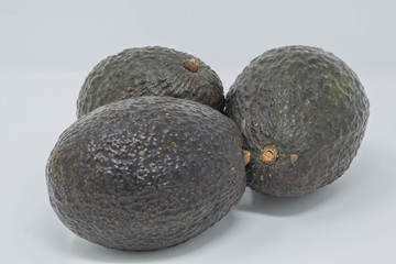Closeup studio shot of three avocados  - 195043408