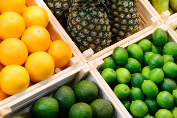 fruits and vegetables in boxes on the counter in the store