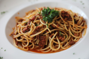 Spaghetti bolognese with beef tometo sauce on wood table , italian food