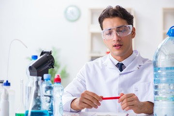 Lab assistant testing water quality