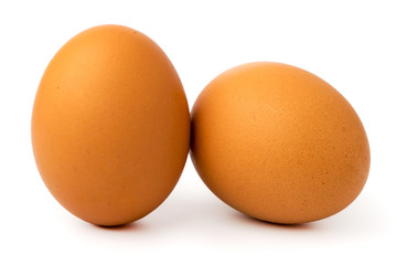 Two chicken eggs on a white