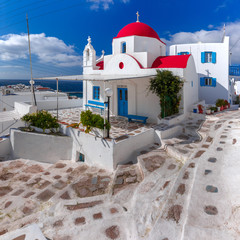 Traditional church with red dome and whitewashed facade, typical Greek church building on the...