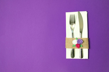white napkin, knife and fork, place for dinner served in rustic style