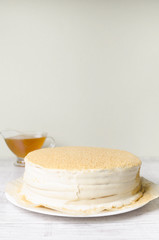 Honey cake on a wooden background