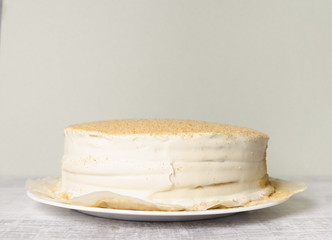 Honey cake on a wooden background