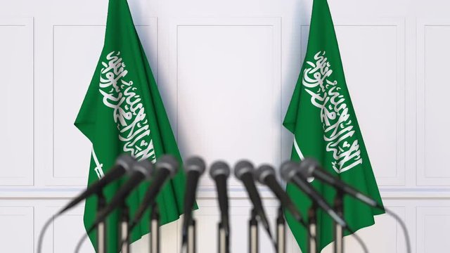 Official press conference. Flags of Saudi Arabia and microphones. Conceptual animation
