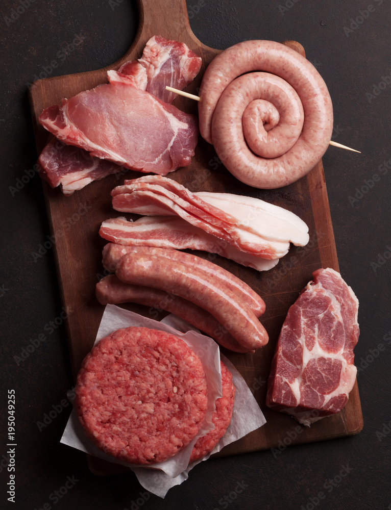 Wall mural raw meat and sausages