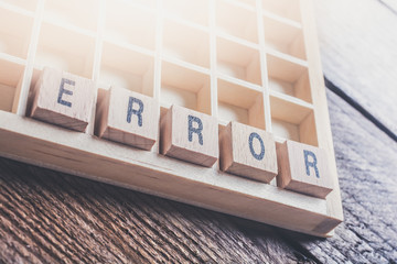 Closeup Of The Word Error Formed By Wooden Blocks In A Type Case
