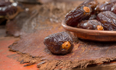 Traditional Middle East dessert, healthy food, big medjool dates fruits.