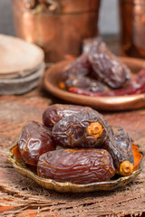 Traditional Middle East dessert, healthy food, big medjool dates fruits.