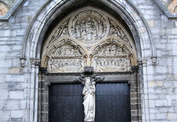 Entrance to Church of our Lady, highly decorated archway of entrance door, Bruges, Belgium