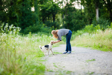 Woman walking with a pet  