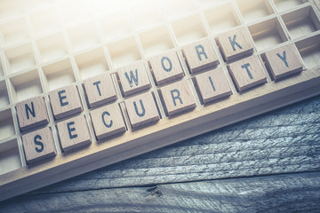 Closeup Of The Words Network Security Formed By Wooden Blocks In A Type Case