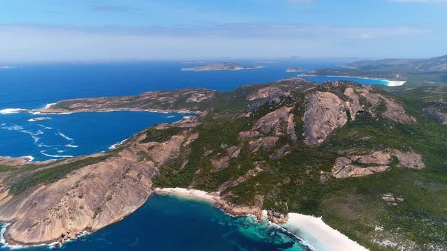Aerial view of picturesque coastline of Hellfire Bay, colorful cliffs and rocks protruding above crystal clear waters of Southern Ocean - Cape Le Grand, Esperance, Western Australia from above, 4k UHD