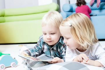 Cute kids review the book