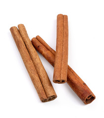 Cinnamon sticks isolated on white background. Top view