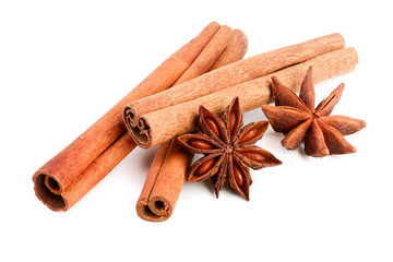 Cinnamon sticks and star anise isolated on white background. Top view