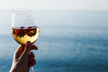 Frozen strawberry sangria cocktail at the edge of the sea.