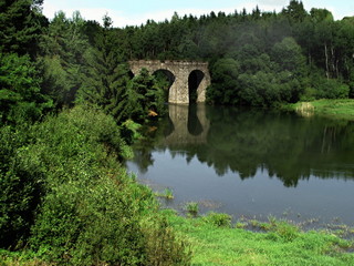 Fototapeta na wymiar Old railway stone bridge, historic technical building, Czech republic, Zelivka