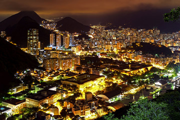 Night view of the top of the Botafogo neighborhood in Rio de Janeiro with city lights, hills and...