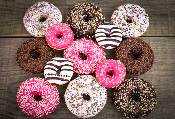 Colorful glazed donuts with sprinkles