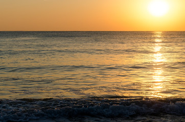 Fototapeta na wymiar Seascape background of sunlight on the sea surface at sunrise